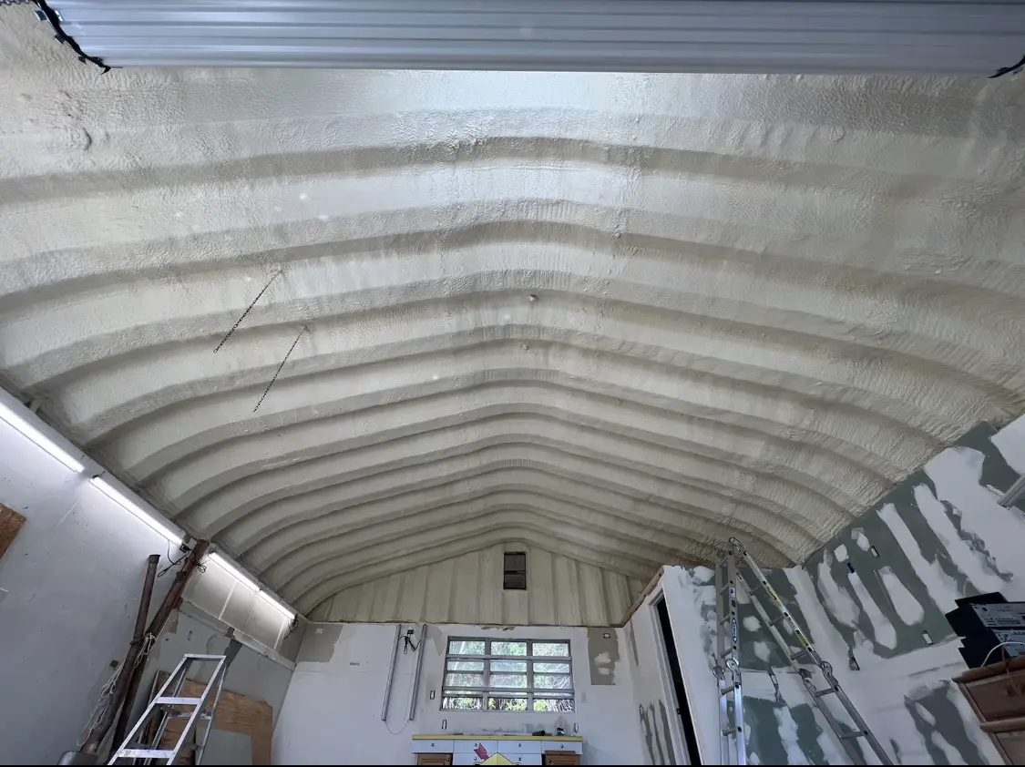 Spray polyurethane foam applied to the underside of a metal roof deck in North Little Rock